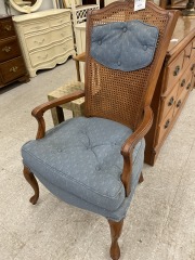 Wooden chair with blue cushion