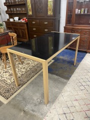 Black Top and Wood Leg Table