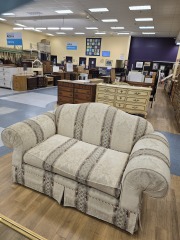 CREAM LOVESEAT WITH RED ACCENTSS