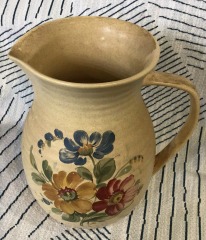 Vintage Hyalyn USA 944 Pottery Pitcher from North Carolina, featuring a pale yellow color with red and blue floral designs.