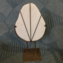 white marble (or a similar natural stone) set within a metal frame