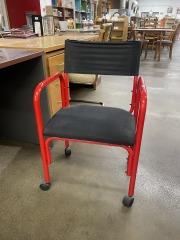 Red Metal Rolling Chair