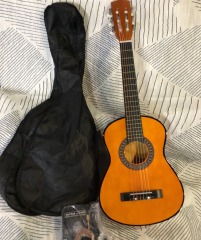 Small, unbranded classical guitar starter kit
