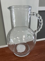 Glass pitcher with bead-style handle