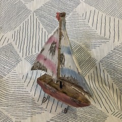 handmade, distressed wooden sailboat decoration.