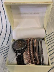 Adrienne Vittadini watch set, featuring a black timepiece and stacked bracelets