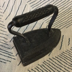 antique cast iron sad iron (also known as a flat iron)
