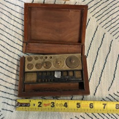 Antique brass apothecary weights. L Oertling Ltd London cased scale weights. Wood case velvet lined