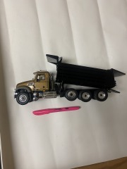 First Gear Gold N Black Mack Dump Truck