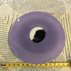 Kosta Boda purple glass platter or plate designed by the Swedish artist Gunnel Sahlin