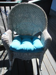 Wicker Rocking Chair With Cushion.