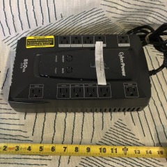 CyberPower uninterruptible power supply (UPS) unit with 850VA capacity.