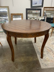Round Dark Wood Studded Dining Table