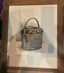 Framed art print features a detailed illustration of a woven basket. Signed etching by artist Judith S. Plucker