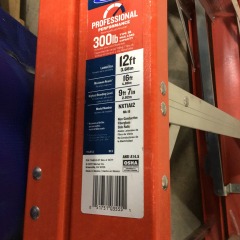 Werner NXT1A12 12-foot fiberglass step ladder with a 300 lb load capacity