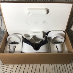Meta Quest 2 virtual reality headset with two Touch controllers packaged in its original box