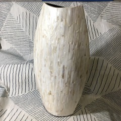 cream-colored ceramic vase