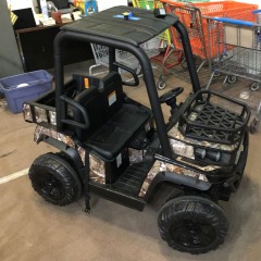 24-volt Dynacraft Realtree UTV ride-on toy, featuring a realistic camouflage design and a functional front cargo rack.