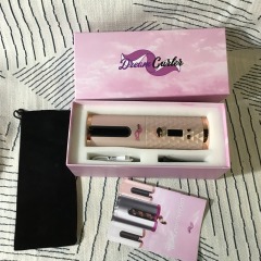 DreamCurler One cordless automatic hair curler in a pink color, complete with its original box