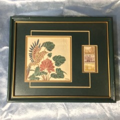 Framed vintage Indonesian display featuring a hand-painted or alongside three Republic of Indonesia postage stamps.