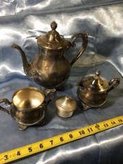 silver-plated tea and coffee service set features pieces by Wm. Rogers & Son