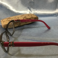 Gucci GG 3683 eyeglasses feature a smokey gray front and bright fuchsia temples