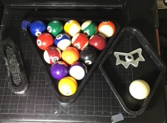 Pool ball set with a triangle rack, a diamond-shaped 9-ball rack, and a brush.
