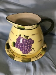 ceramic pitcher and coordinating underplate are part of the \