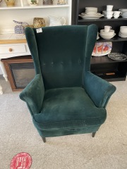 Green velvet wingback chair