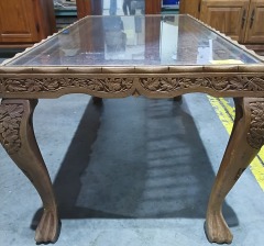 Carved wood coffee table w\/glass top 3512