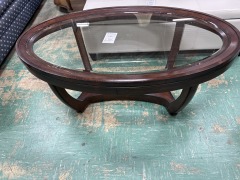Dark wood oval glass top coffee table